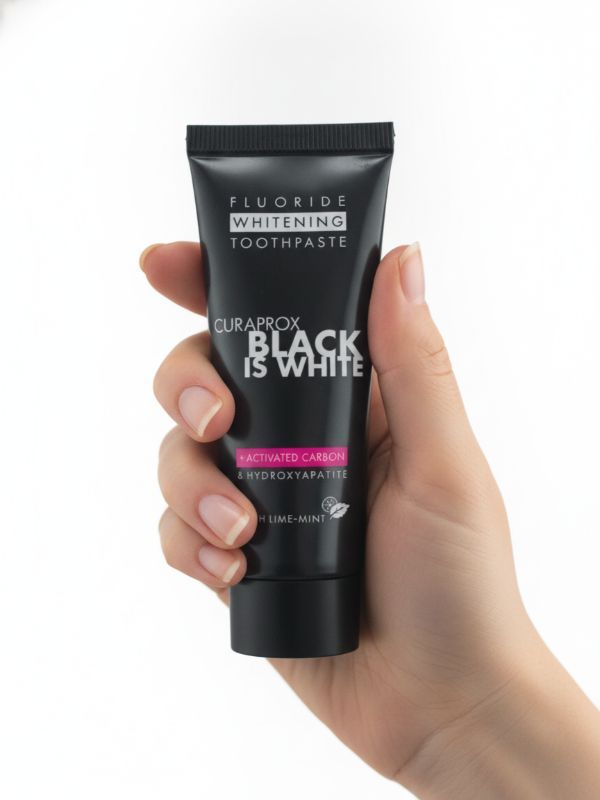 Зубна паста Curaprox Black is White mini міні-версія з активованим вугіллям (чорна упаковка), 10 мл., RDA - 50